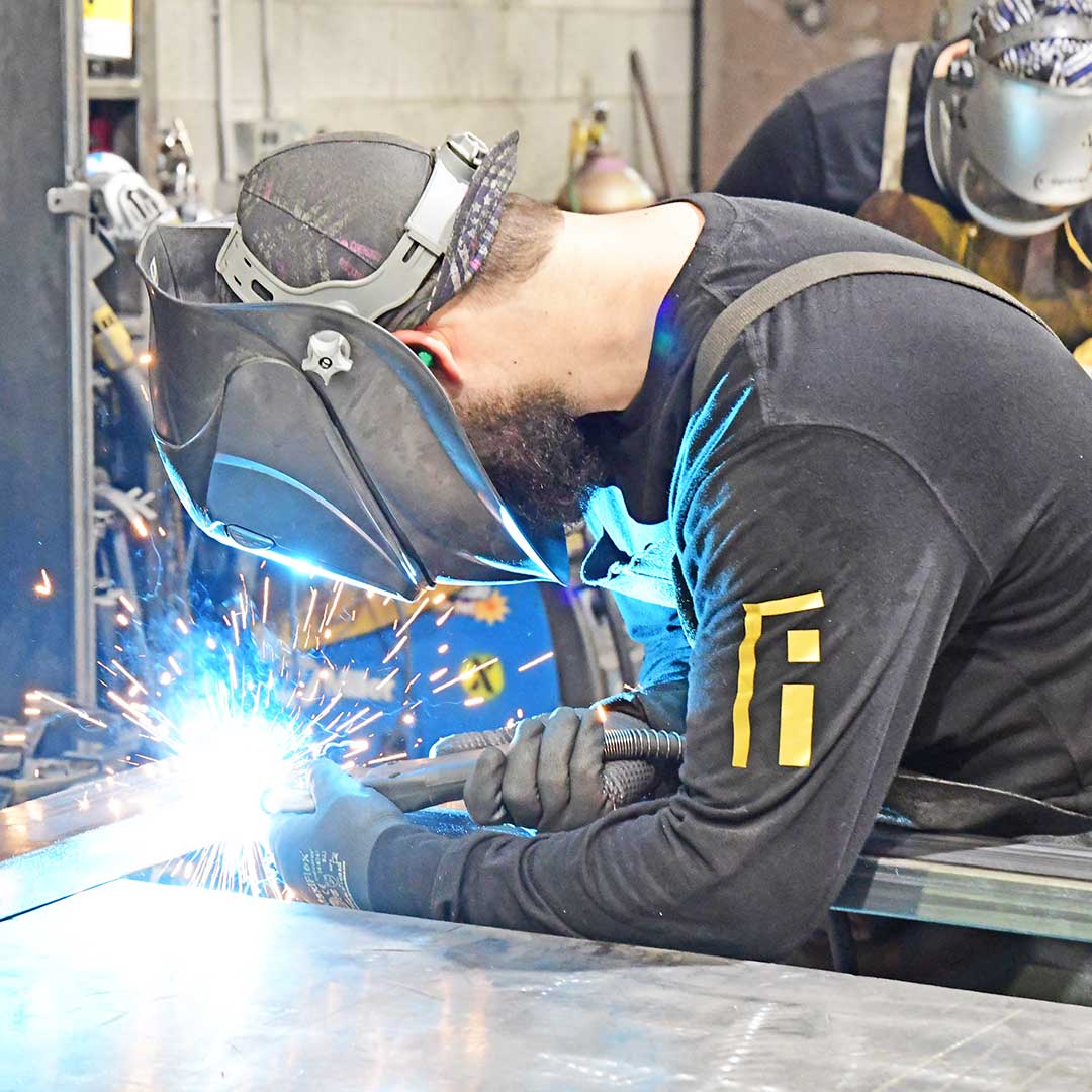 First Impression Ironworks craftsman welding an Iron Entry Door