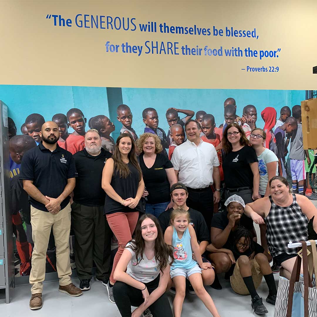 First Impression Ironworks Employees Group Picture at Feed My Starving Children