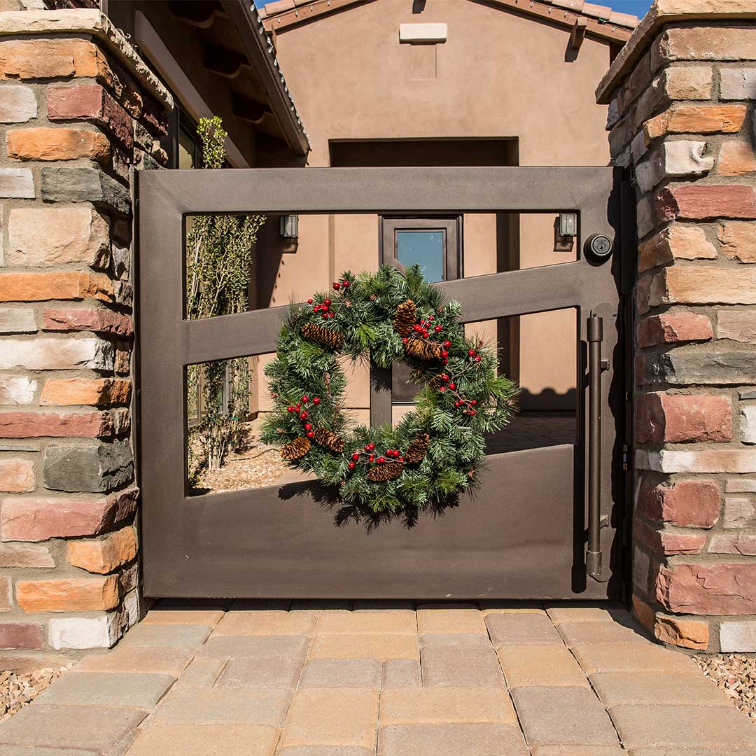 Iron Courtyard Gate with Holiday Wreath