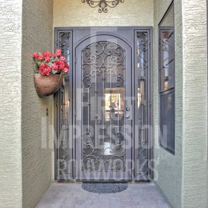 Mediterranean iron security door with sidelights