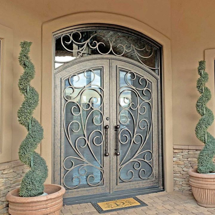First Impression Ironworks iron and glass entry door with intricate scrollwork