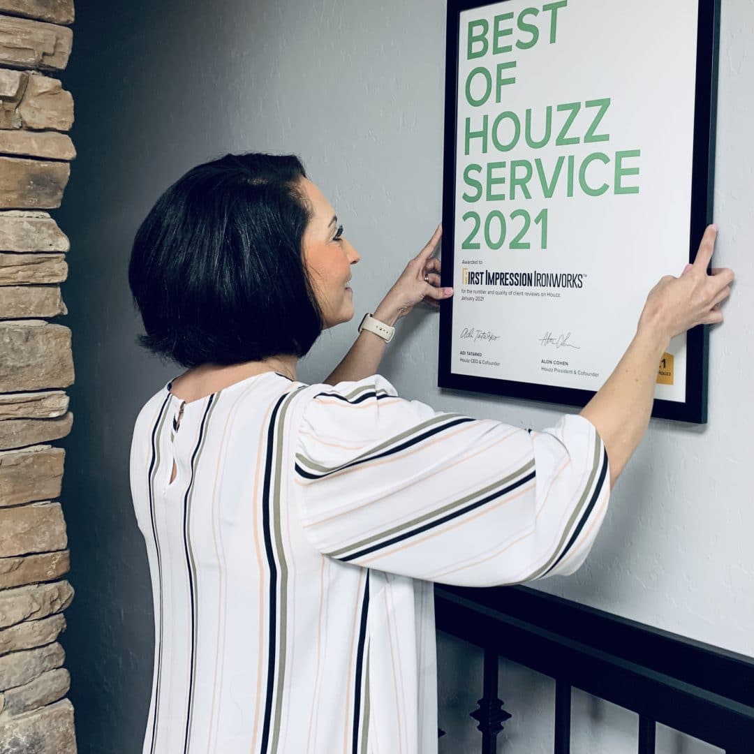 First Impression Ironworks Employee Hanging Best of Houzz Service 2021 Award