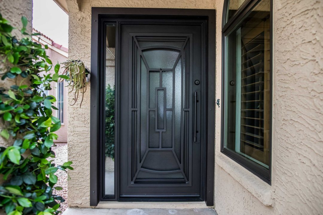 1st Impression Ironworks black iron and glass entry door with a window sidelight which can be shipped nationwide.