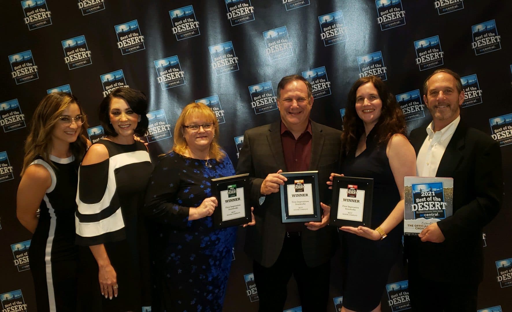 First Impression Ironworks team members holding all 3 of the Best of the Desert awards