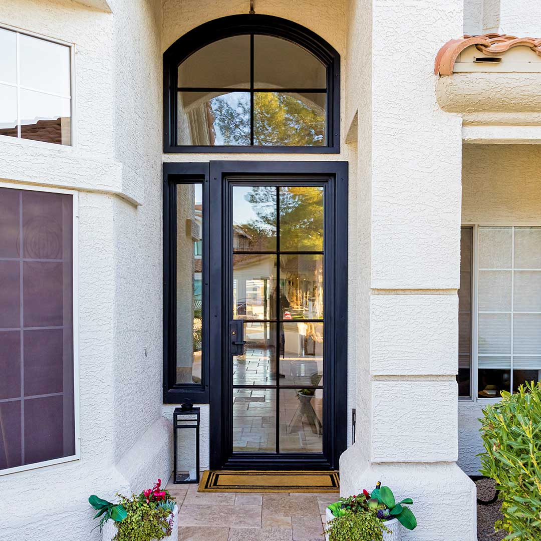modern black iron and glass entry door with matching glass transom and sidelights