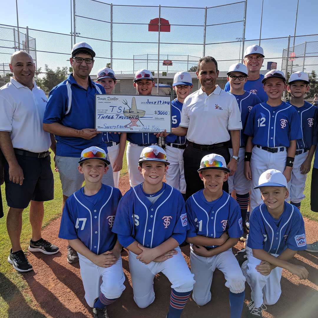 Tempe Diablos presenting a check to a baseball team