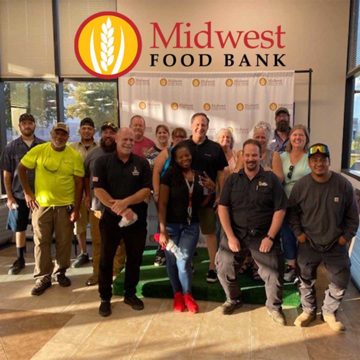 Group of First Impression Ironworks employees, standing together at Midwest Food Bank
