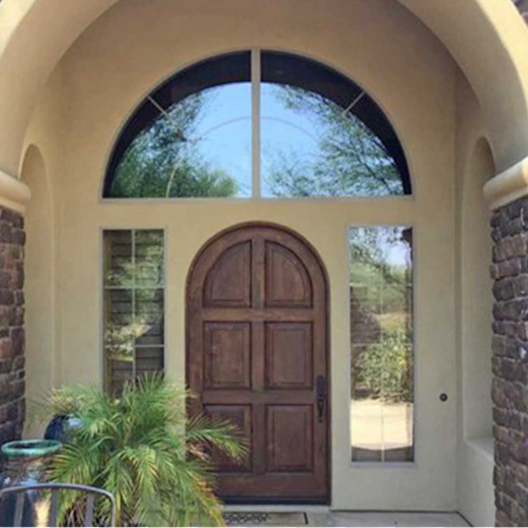 Single wooden arched door before it was replaced with double First Impression Ironworks Iron Entry Doors