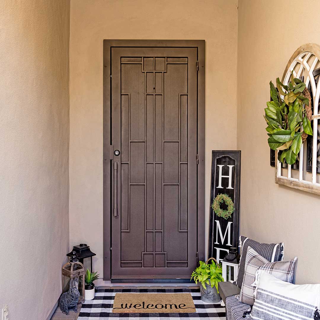 First Impression Iron Entry Door with intricate geometric design with metal mesh