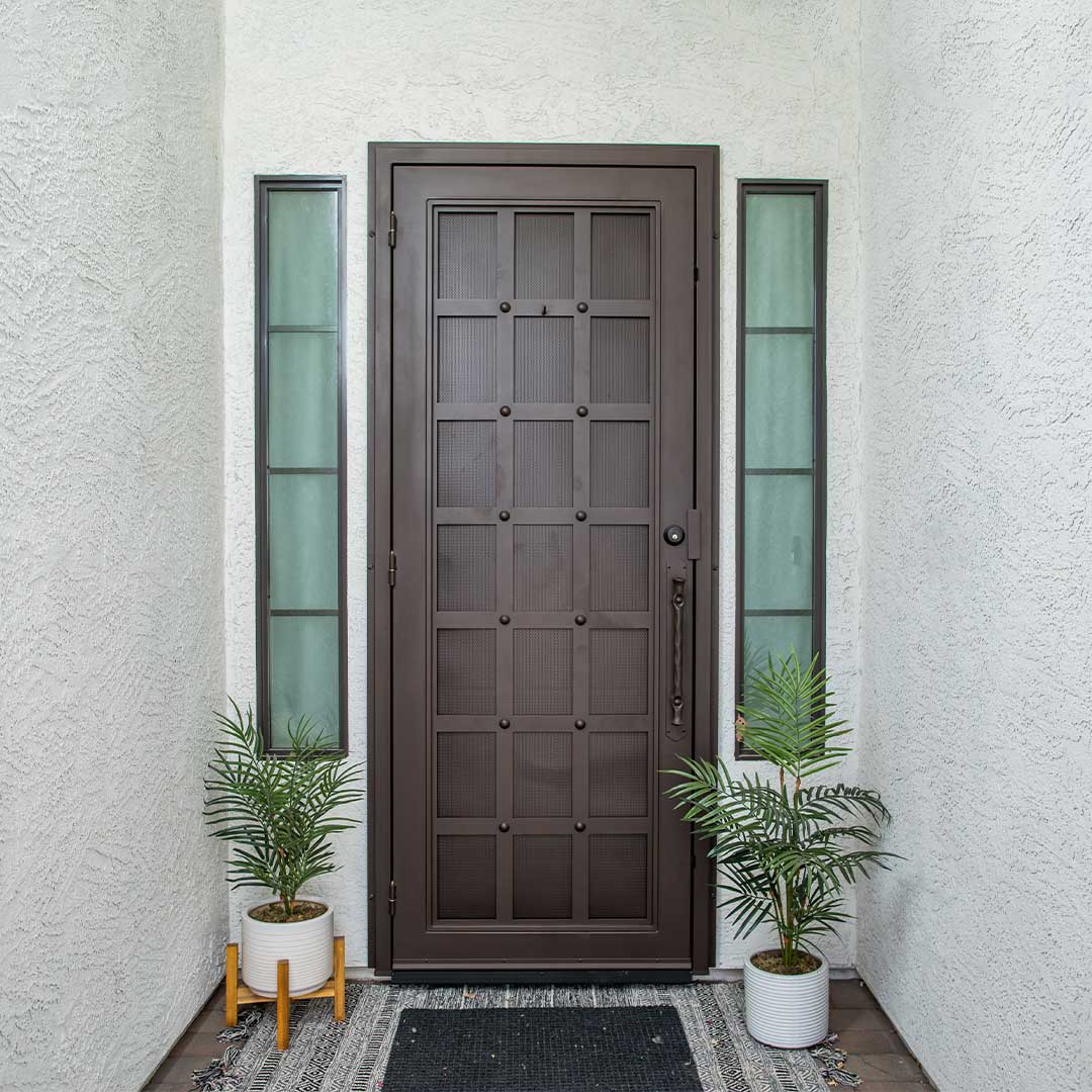 Bronze colored Iron Entry Door with a geometric pattern with metal mesh