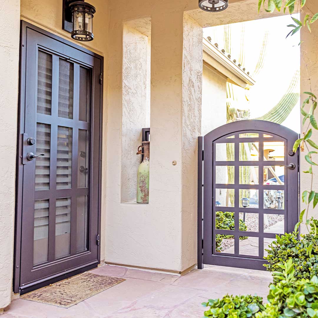 Dark brown iron security door and gate made by First Impression Ironworks