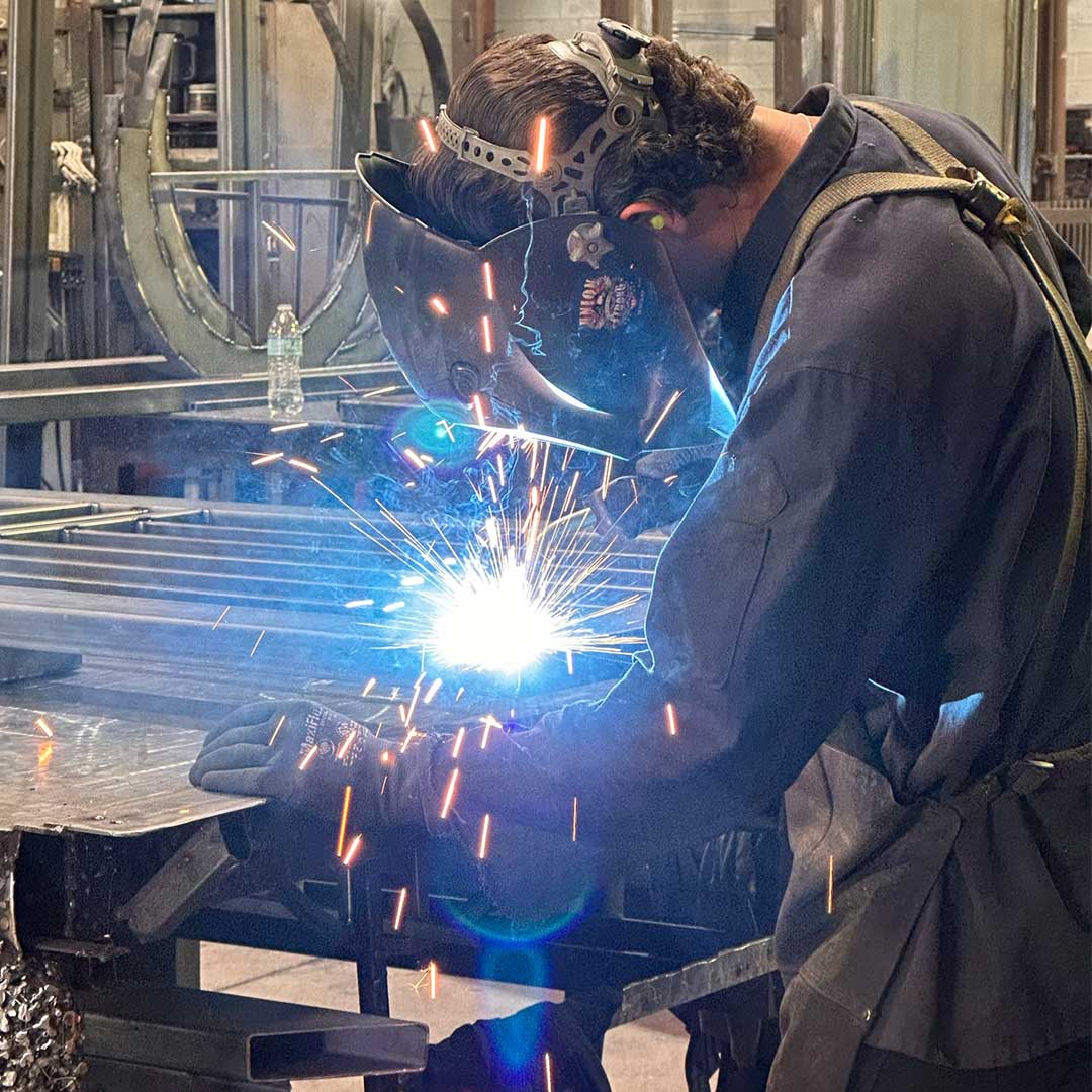 First Impression Ironworks Fabricator welding an iron door