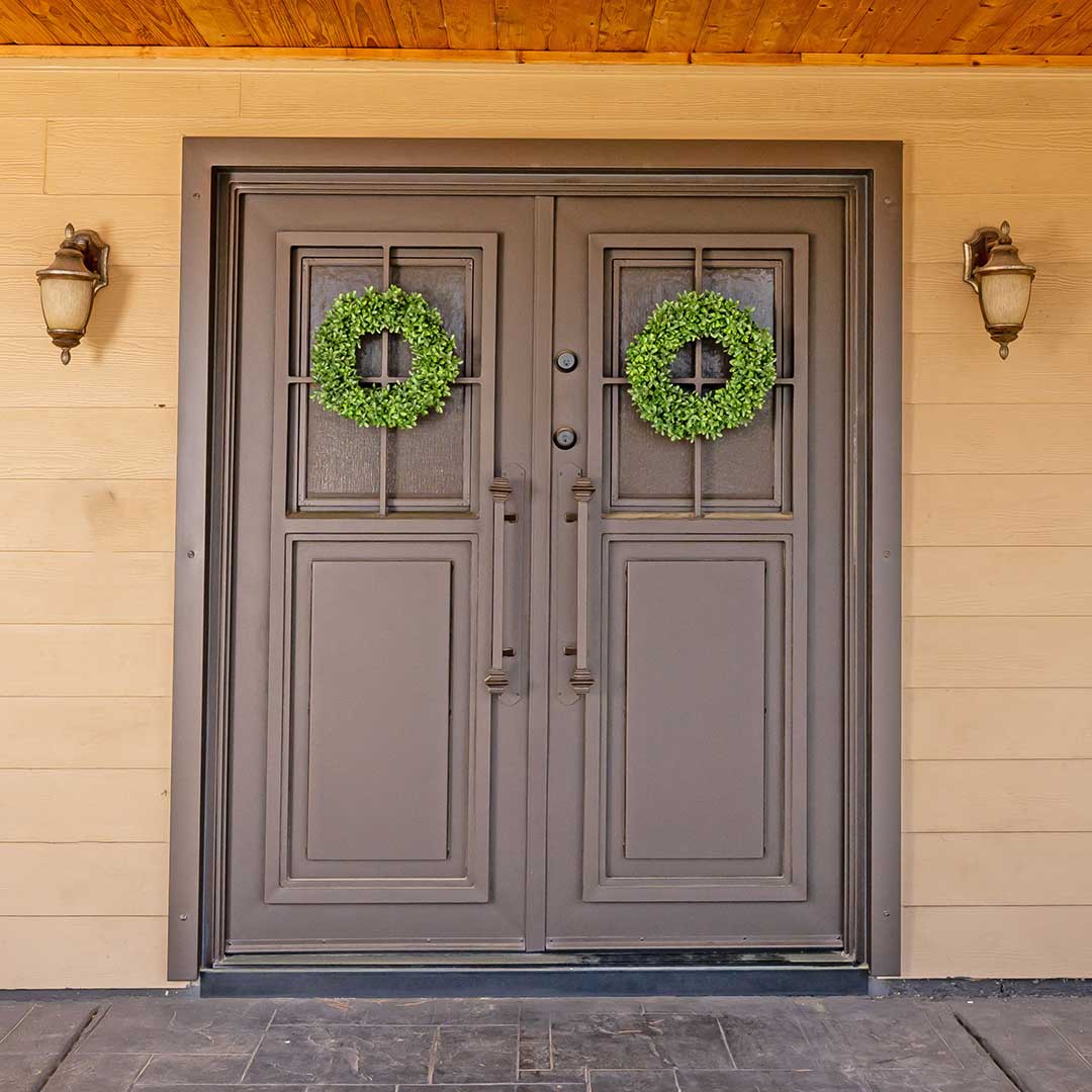 After image of a large French iron entry door installed by First Impression Ironworks