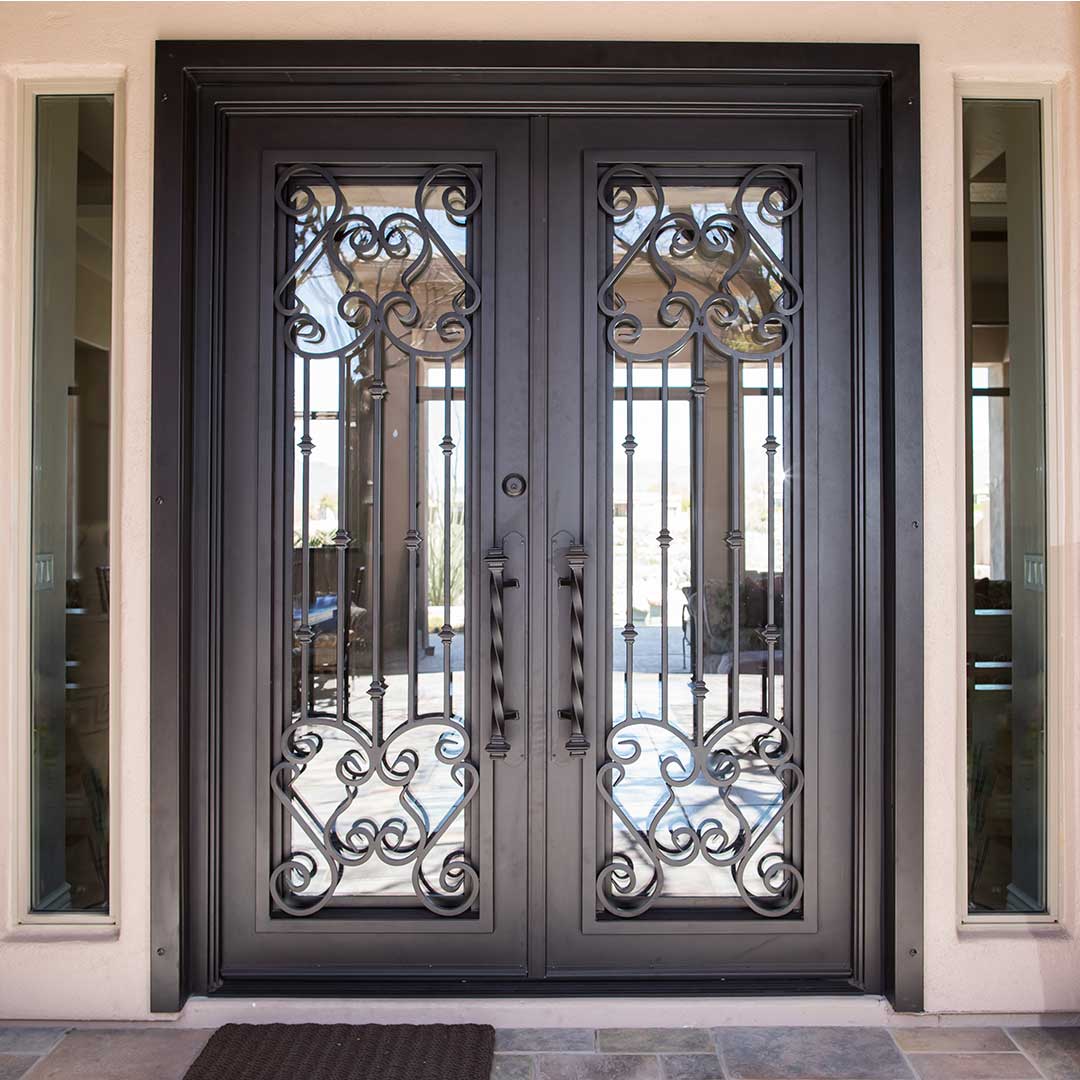 First Impression Ironworks French Tip Double Doors with scrolled details and a glass panel