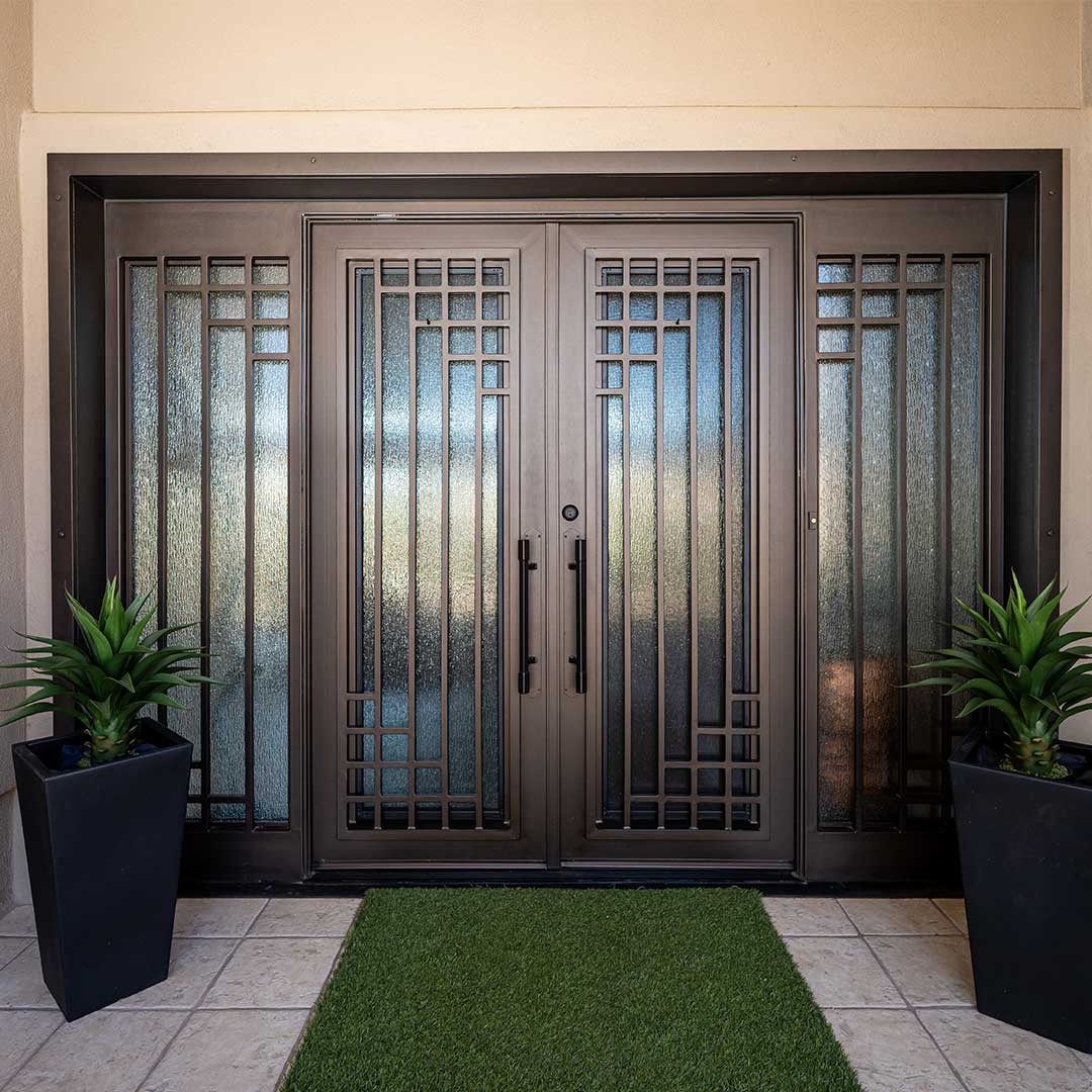 Brown geometric iron and glass entry door by First Impression Ironworks