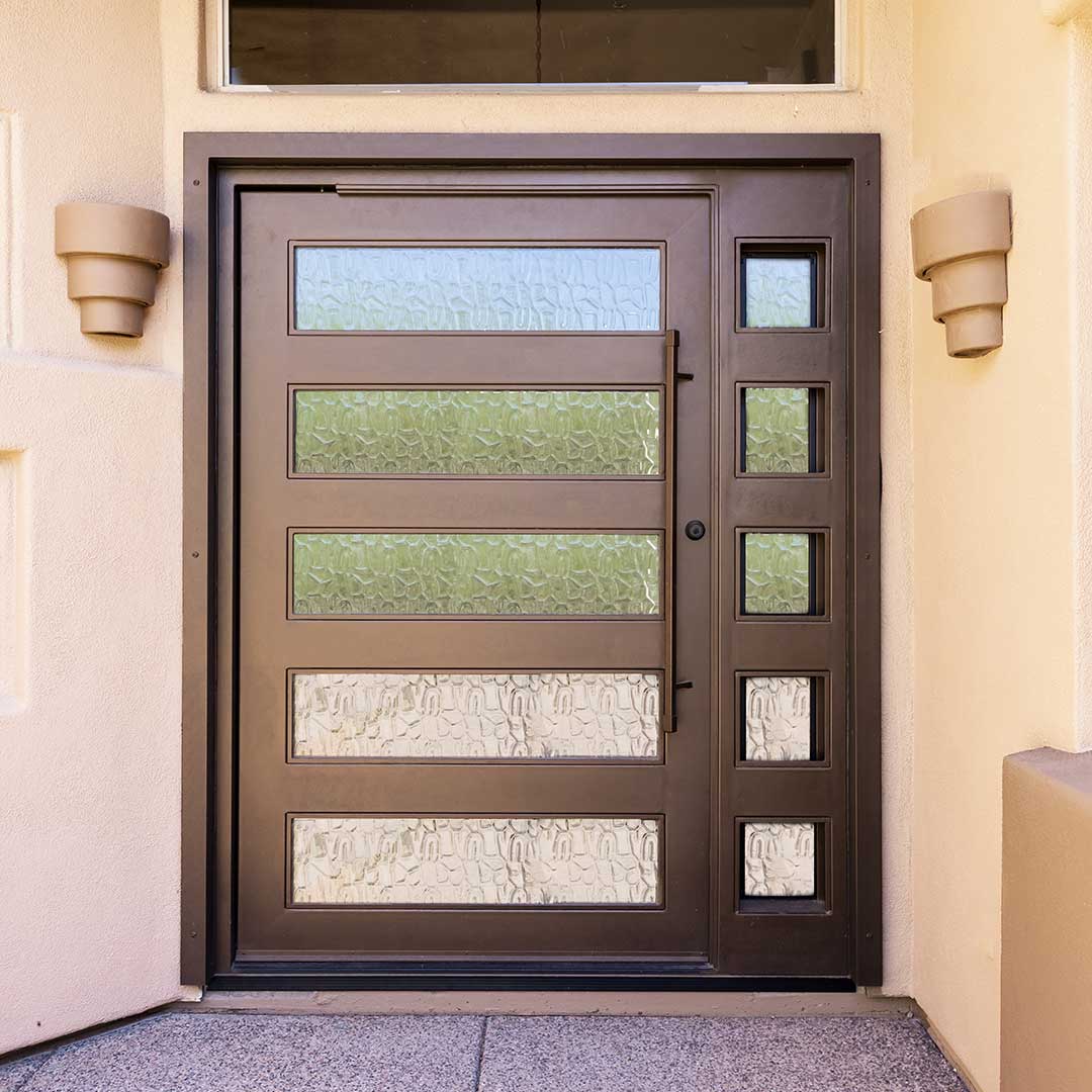 Bronze colored desert contemporary iron entry door by First Impression Ironworks