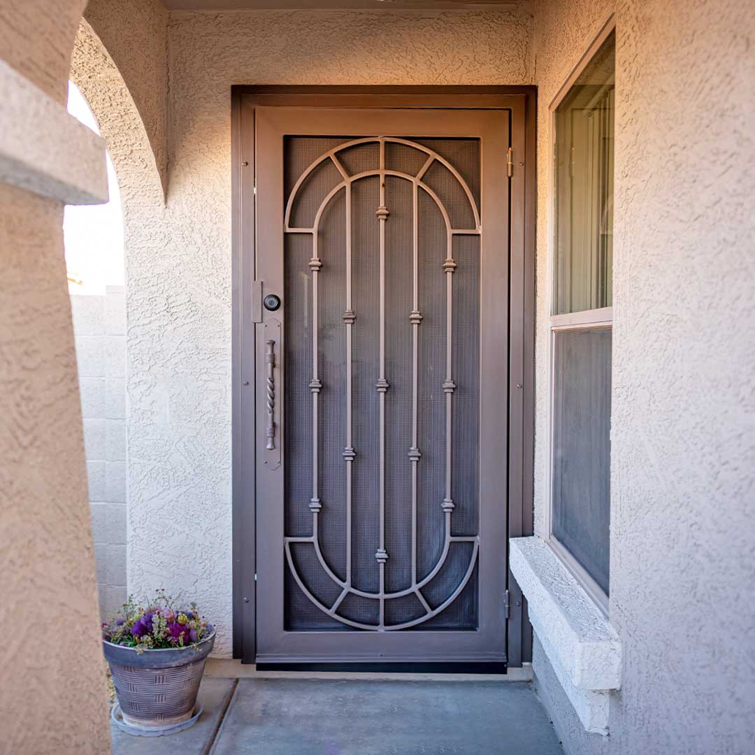 A First Impression Ironworks security door installed on a front door.