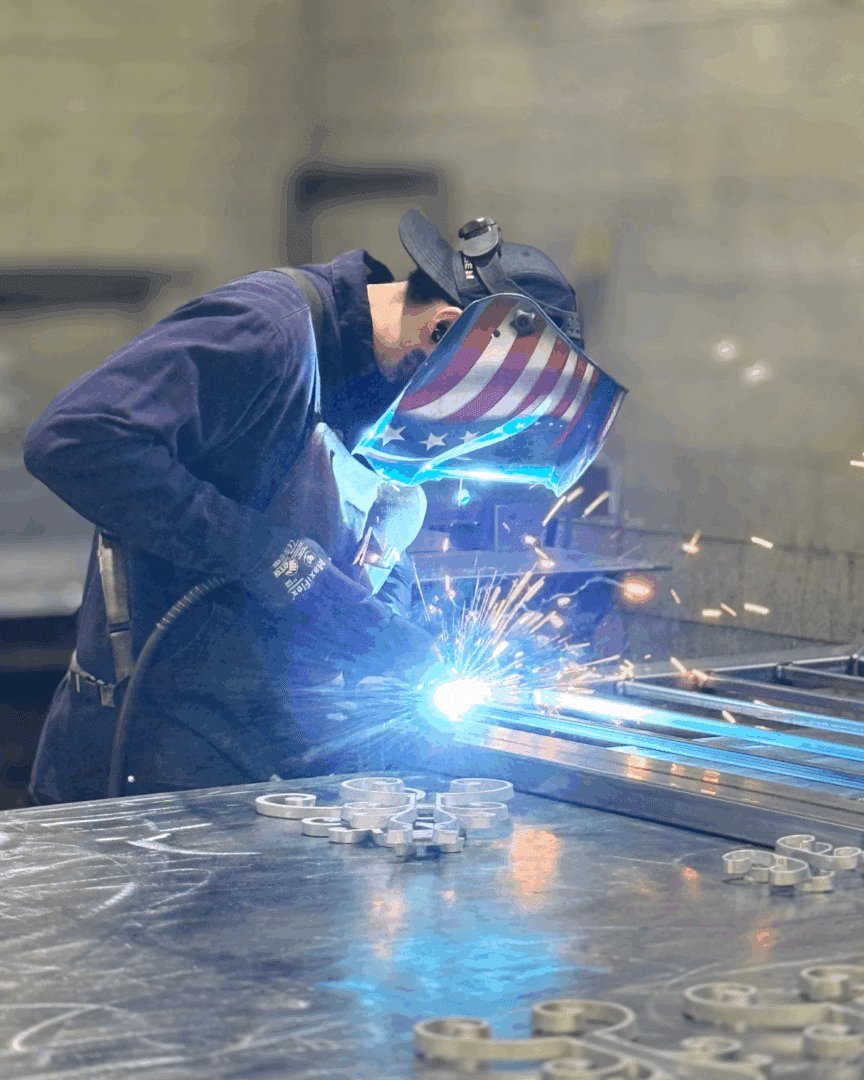 First Impression Ironworks welder working on an iron security door