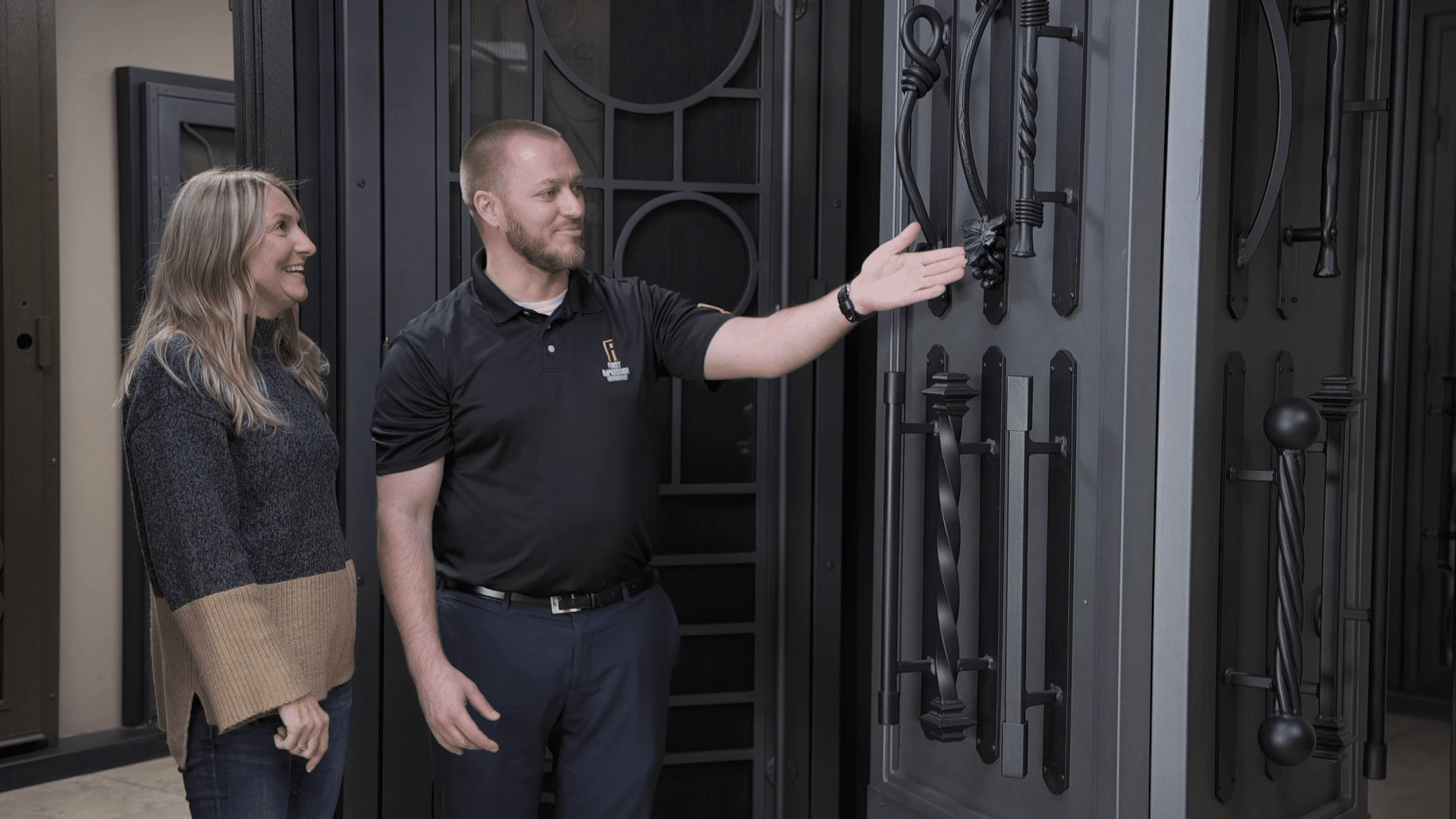 First Impression Ironworks design specialist working with a homeowner in a showroom