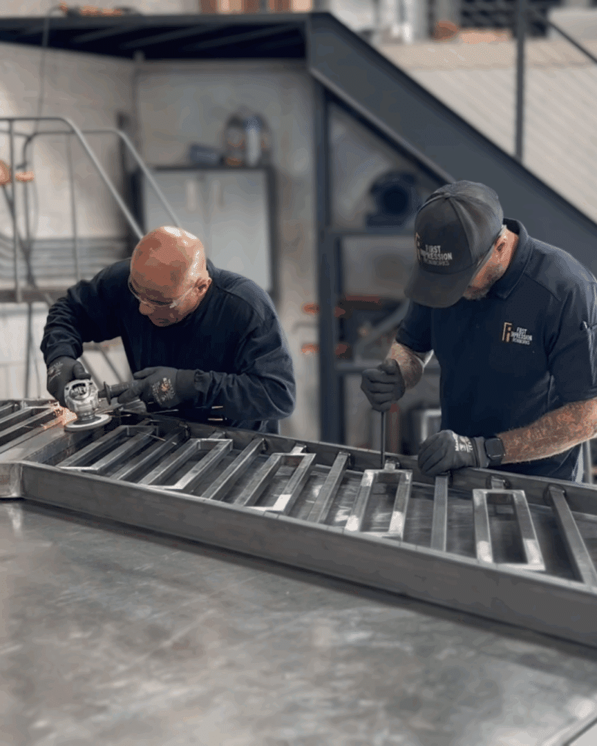 First Impression Ironworks artisans perfecting a custom iron railing