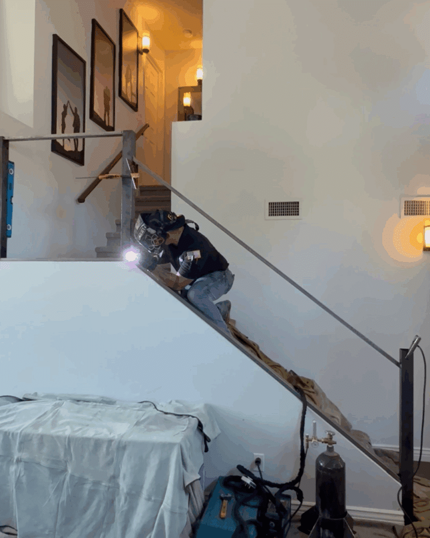 First Impression Ironworks team member mocking up the homeowner's new iron railing