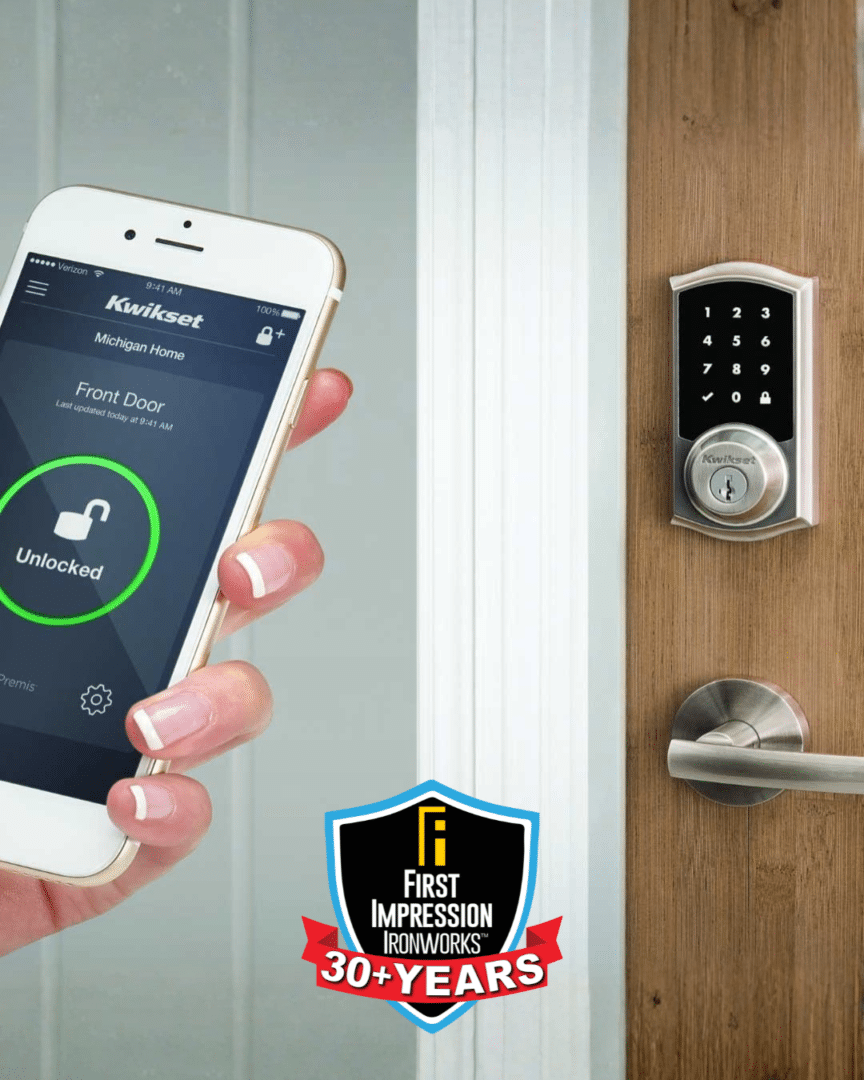 Hand holding a smart phone, with the Kwikset digital lock app pulled up, in front of a door with a Kwikset digital lock