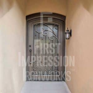Texas Plasma Arched Iron Entry Door with Twisted Pickets & Big Braid