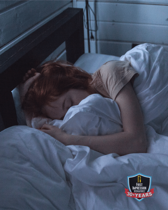 Woman sleeping soundly in a bed