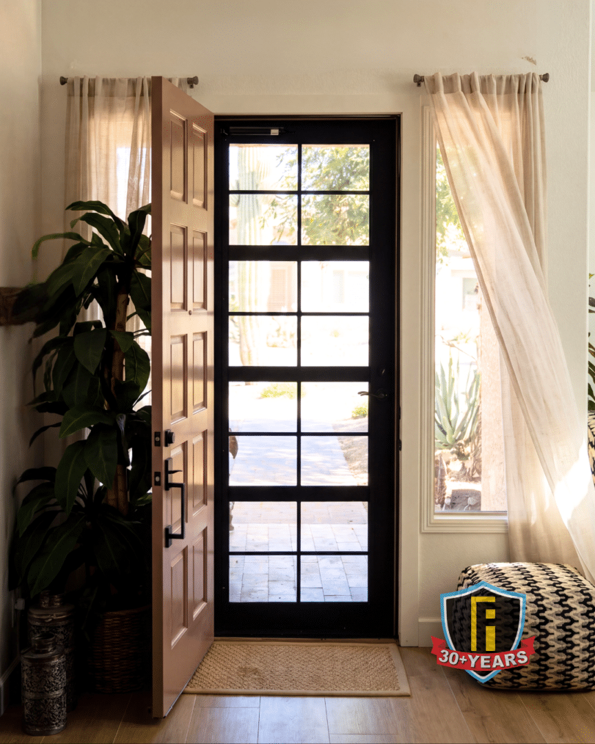 Inside of a First Impression Ironworks Security Door, with the original front door open, showing how air can flow through your home